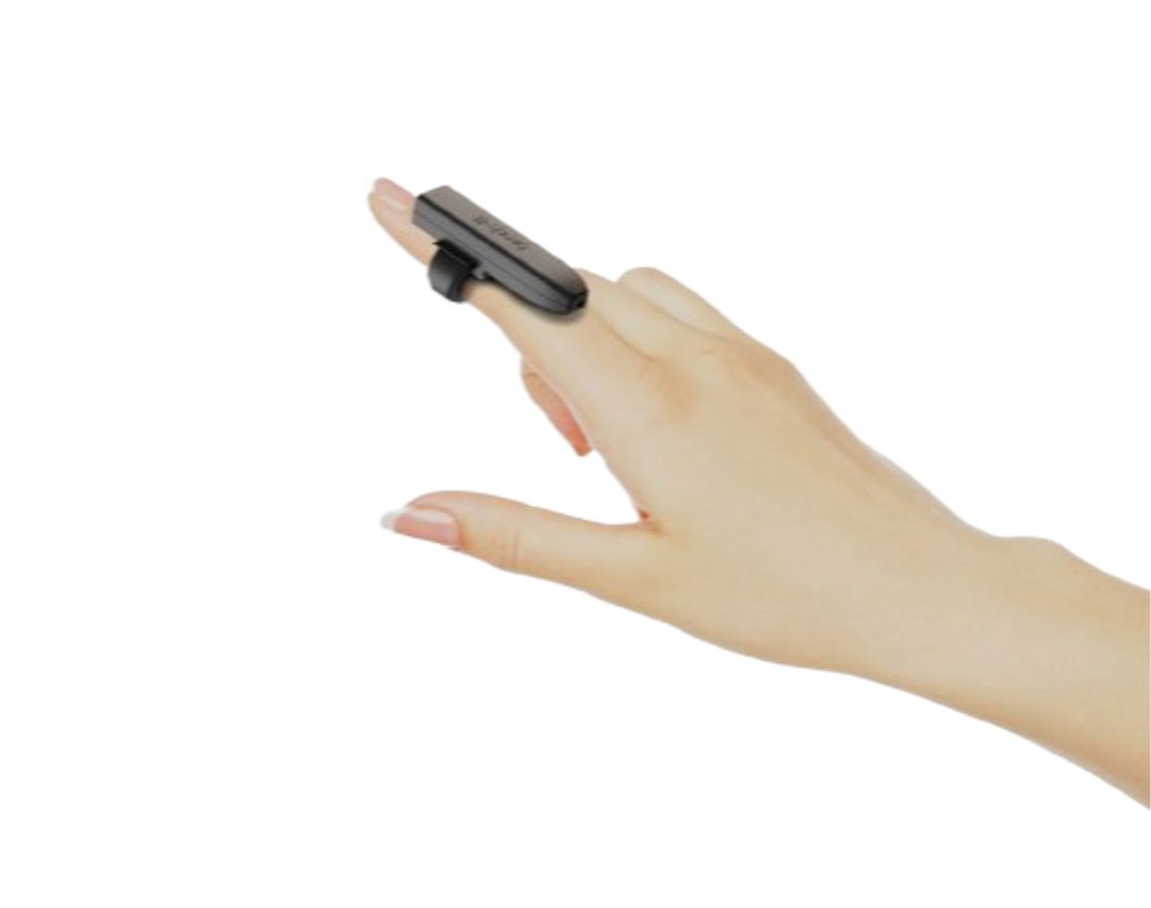 A hand with the small black torch-It camera module strapped to the index finger like a ring, its lens facing forward past the fingertip.